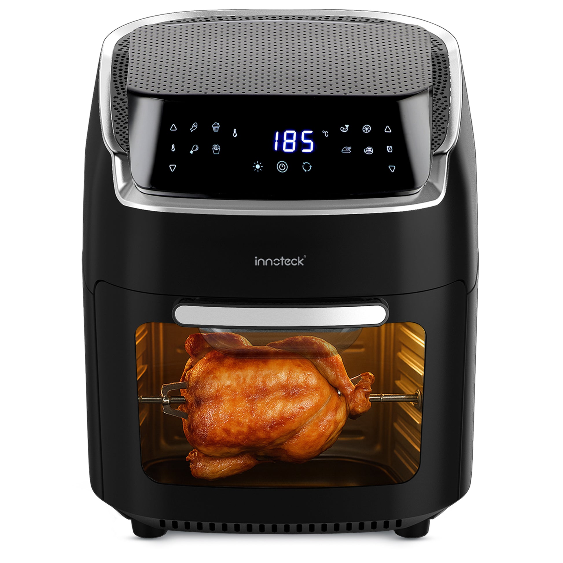 Black air fryer with a rotisserie chicken inside on a white background