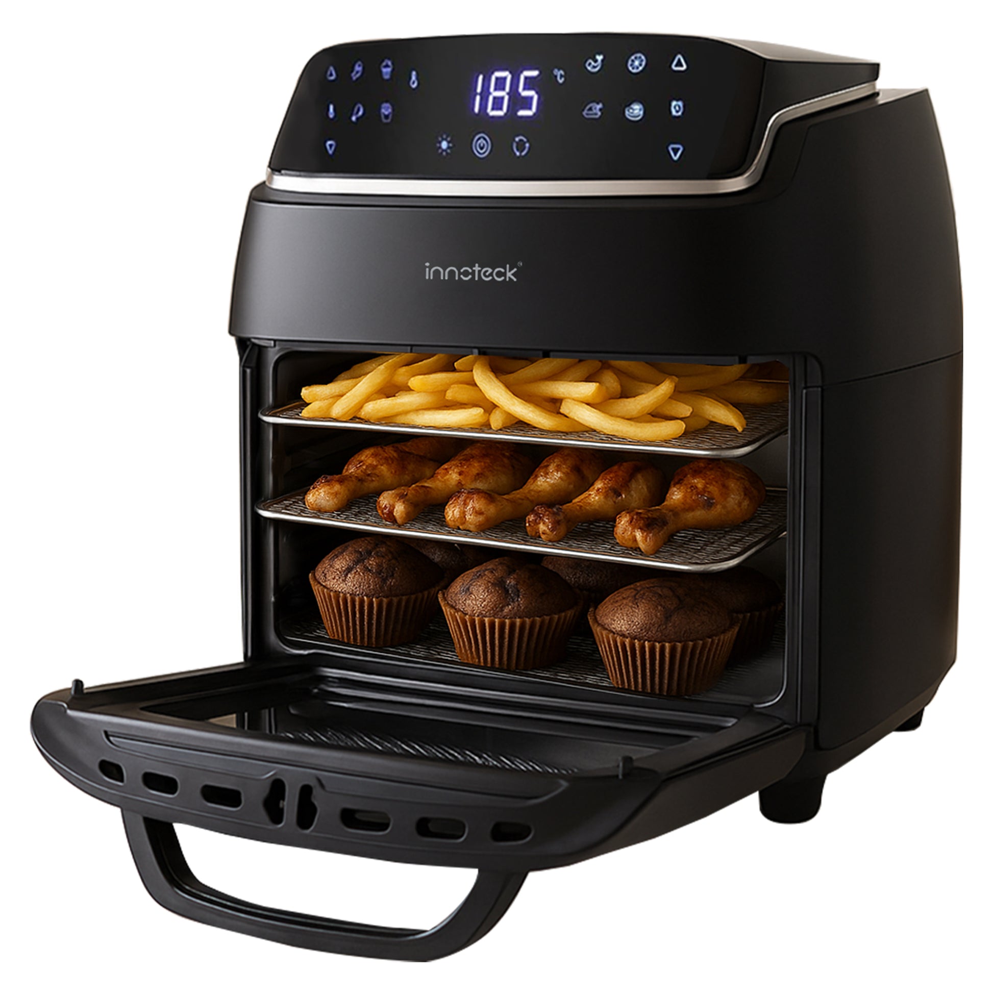 Black air fryer with food items on the racks on a white background